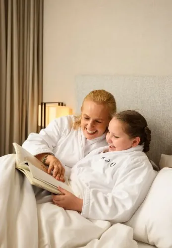 Mother and daughter wearing Dao branded bathrobes.