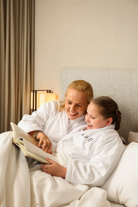 Mother and daughter wearing Dao branded bathrobes.