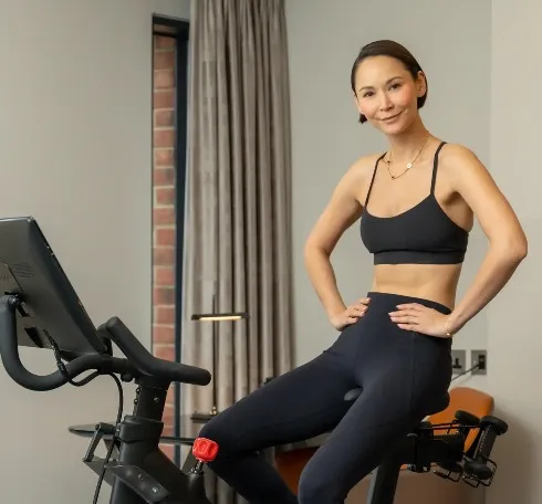 Woman in a cardio machine in a Dao by Dorsett gym.