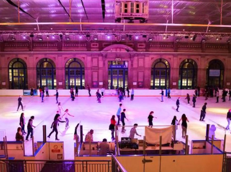 People ice skating at Alexandra Place in London.