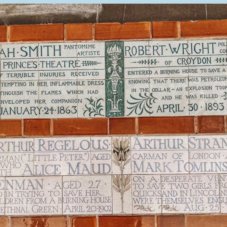 A wall of plaques at the Postmans Park.