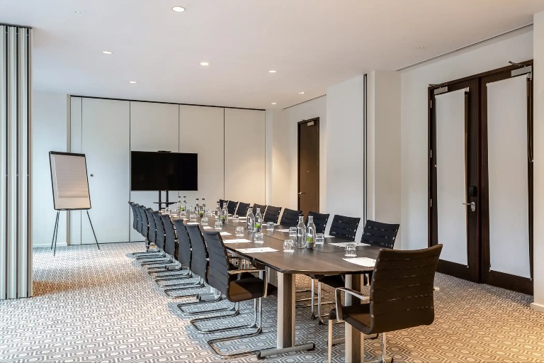 Conference table and a TV in the Puffin Suite, West London.